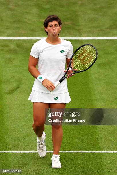 Carla Suarez Navarro of Spain reacts in her Ladies' Singles First Round match against Ashleigh Barty of Australia during Day Two of The Championships...