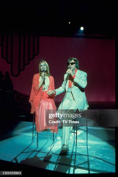 Lennie Peters and Dianne Lee of British pop duo Peters And Lee performing on stage, circa 1976.