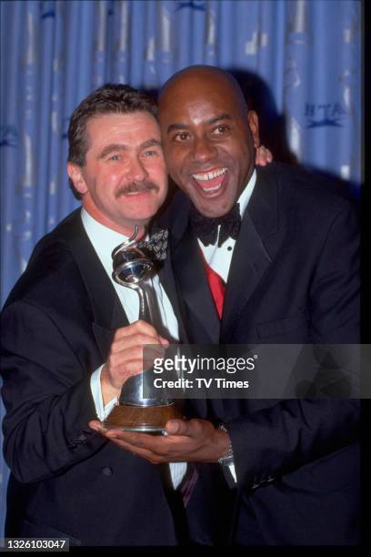 Celebrity chefs Kevin Woodford and Ainsley Harriott at the National Television Awards at the Royal Albert Hall in London on October 8, 1997.