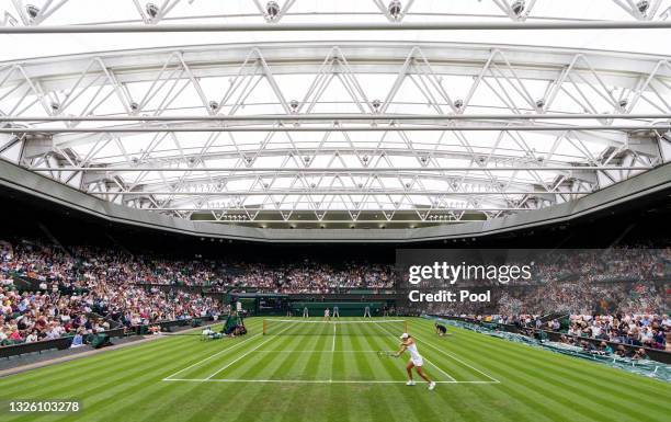 General view of Centre Court as Ashleigh Barty of Australia plays a backhand in her Ladies' Singles First Round match against Carla Suarez Navarro of...