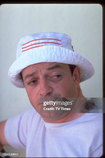 Actor Tim Healy in character as Dennis Patterson in comedy drama Auf Wiedersehen, Pet, circa 1986.