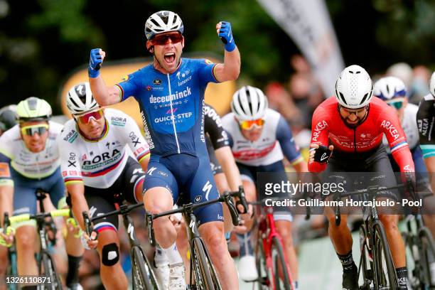 Mark Cavendish of The United Kingdom and Team Deceuninck - Quick-Step stage winner celebrates at arrival, Peter Sagan of Slovakia and Team BORA -...