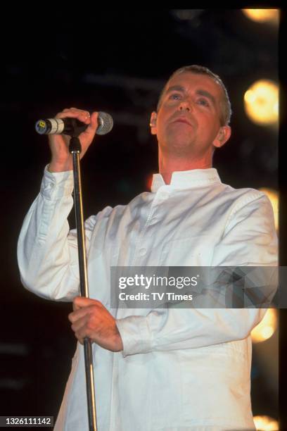 Vocalist Neil Tennant of English synth pop group Pet Shop Boys performing live on stage at London Gay Pride on Clapham Common, July 5, 1997.
