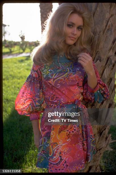 Actress Alexandra Bastedo posed in a psychedelic paisley dress, circa 1969.