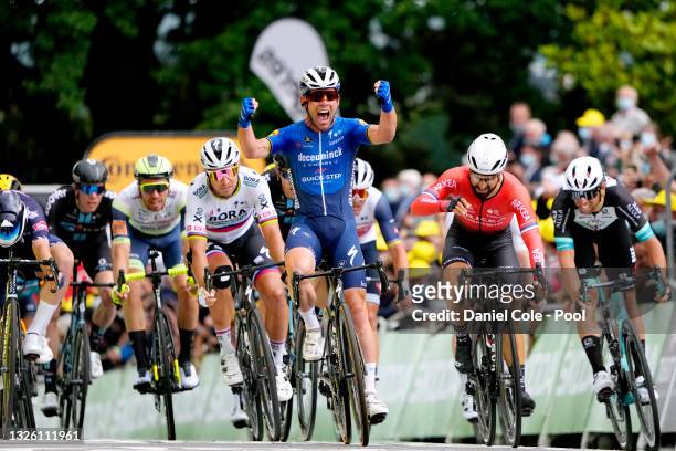 Jasper Philipsen of Belgium and Team Alpecin-Fenix, Mark Cavendish of The United Kingdom and Team Deceuninck - Quick-Step stage winner celebrates at...