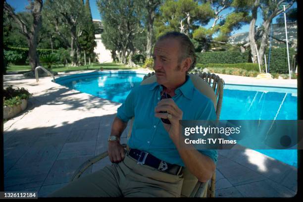 Actor David Niven sitting by the swimming pool at his villa in Saint-Jean-Cap-Ferrat, France, circa 1971.