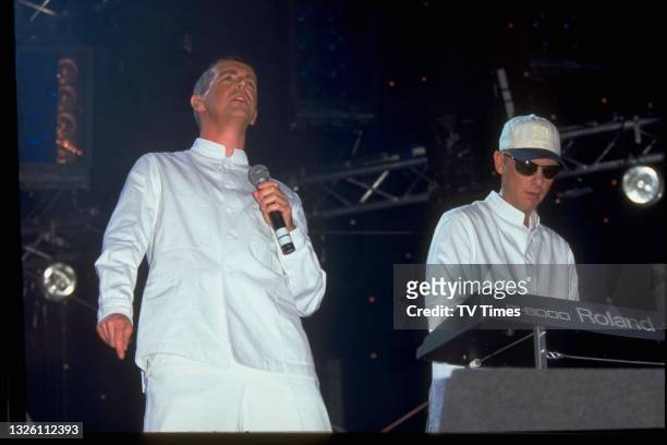 Neil Tennant and Chris Lowe of English synth pop group Pet Shop Boys performing live on stage at London Gay Pride on Clapham Common, July 5, 1997.