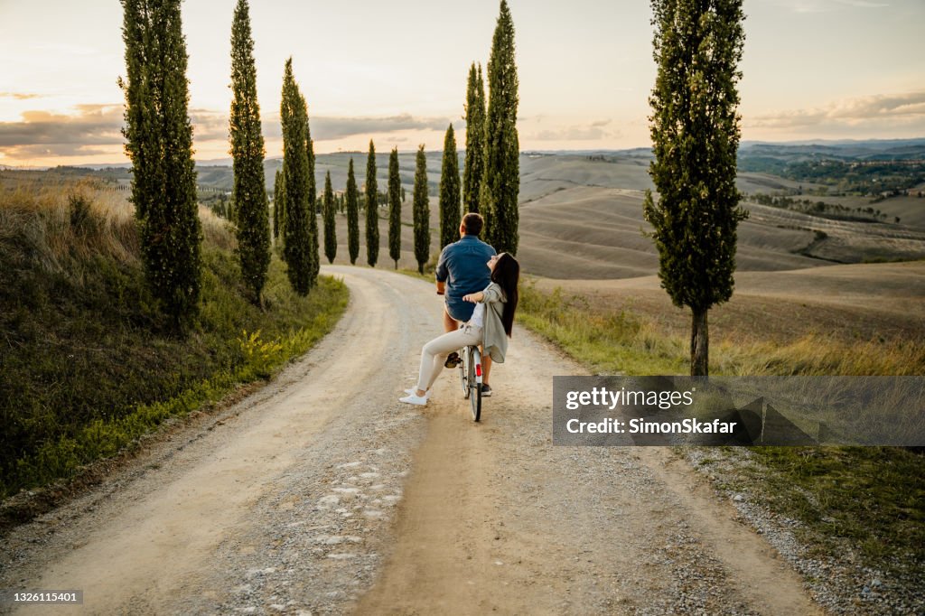 Couple riding on the bicycle