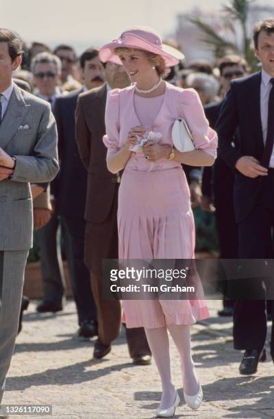Prince Charles and Diana, Princess of Wales during a visit to Sicily, Italy, 30th April 1985. The Princess is wearing a pink dress by Catherine...