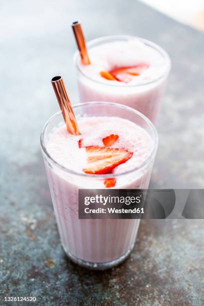 two glasses of strawberry smoothie - strawberry smoothie stock pictures, royalty-free photos & images