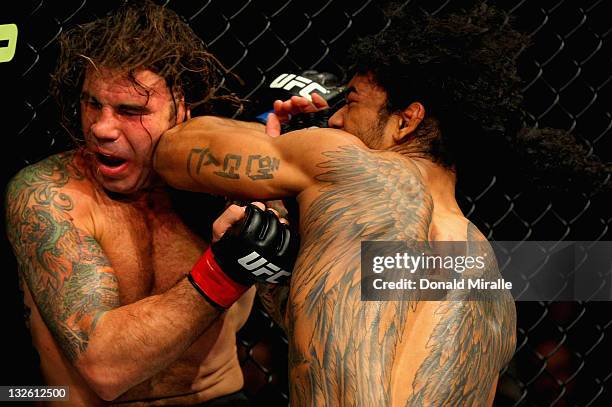 Benson Henderson elbows Clay Guida during their lightweight bout during the UFC on FOX event at the Honda Center on November 12, 2011 in Anaheim,...