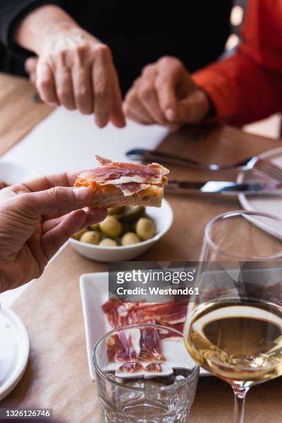 friends having tapas at table in restaurant - spain food stock pictures, royalty-free photos & images