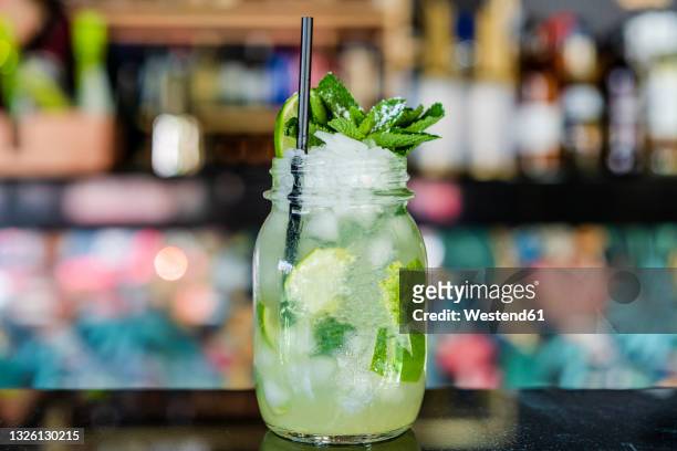mojito in jar on table at restaurant - mojito stock pictures, royalty-free photos & images