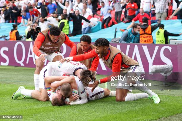 Harry Kane of England celebrates with team mates after scoring their side's second goal during the UEFA Euro 2020 Championship Round of 16 match...