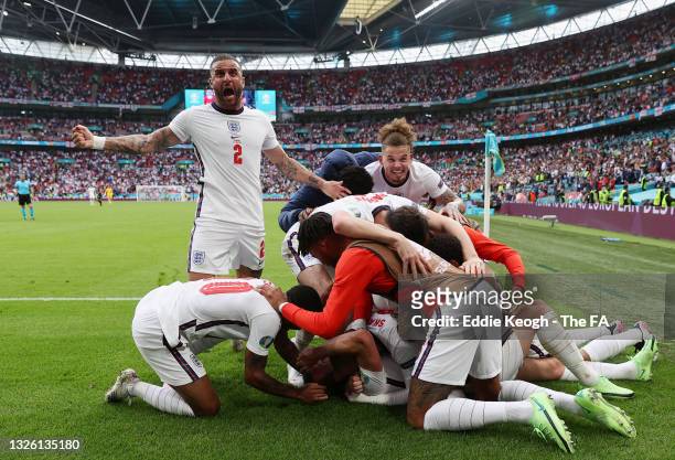 Harry Kane of England celebrates with Kyle Walker and team mates after scoring their side's second goal during the UEFA Euro 2020 Championship Round...