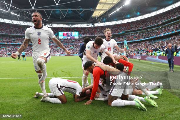 Harry Kane of England celebrates with Kyle Walker and team mates after scoring their side's second goal during the UEFA Euro 2020 Championship Round...