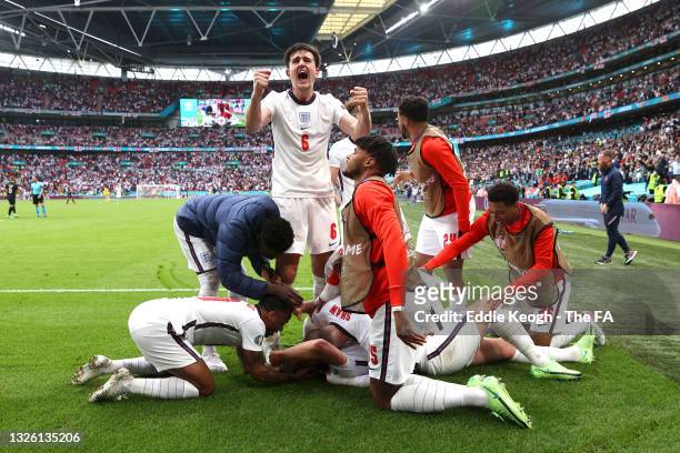 Harry Kane of England celebrates with Harry Maguire and team mates after scoring their side's second goal during the UEFA Euro 2020 Championship...