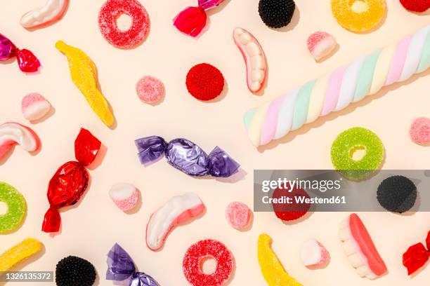 background of various halloween candies - wrapped candy stock pictures, royalty-free photos & images
