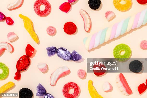 background of various halloween candies - candies stock pictures, royalty-free photos & images