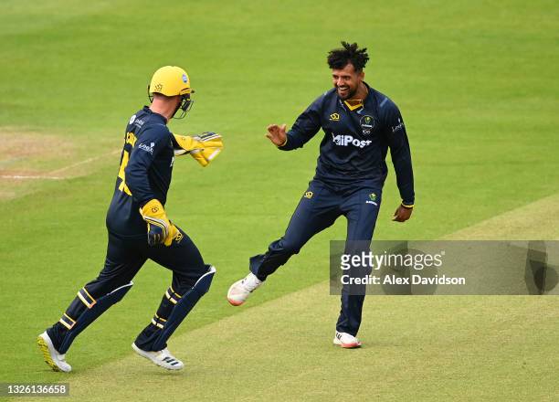 Prem Sisodiya of Glamorgan celebrates taking the wicket of Will Jacks of Surrey with Chris Cooke during the Vitality T20 Blast match between...