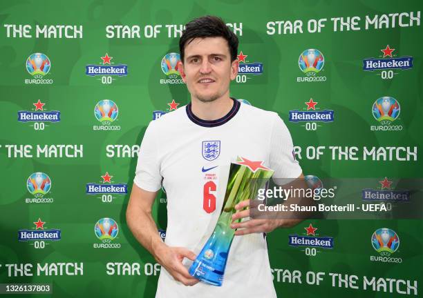 Harry Maguire of England poses for a photograph with their Heineken "Star of the Match" award after the UEFA Euro 2020 Championship Round of 16 match...