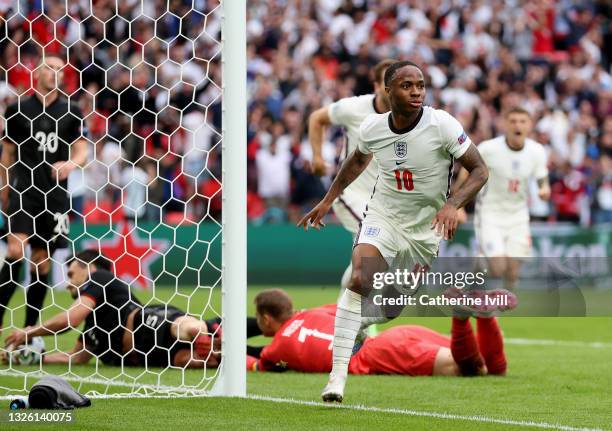 Raheem Sterling of England celebrates after scoring their side's first goal during the UEFA Euro 2020 Championship Round of 16 match between England...