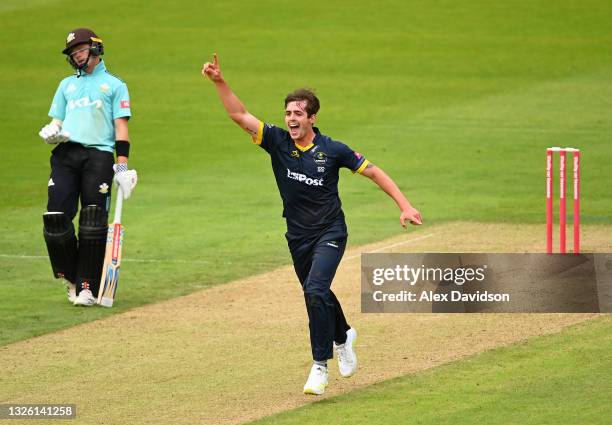 Roman Walker of Glamorgan celebrates taking the wicket of Rory Burns of Surrey during the Vitality T20 Blast match between Glamorgan and Surrey at...