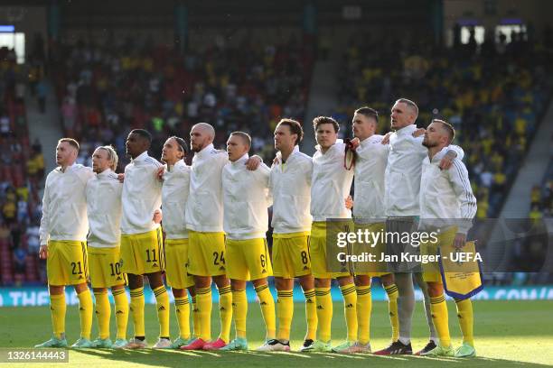 Players of Sweden stand for the national anthem prior to the UEFA Euro 2020 Championship Round of 16 match between Sweden and Ukraine at Hampden Park...