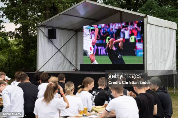 Fans reacting outside in a beer garden on the UEFA EURO 2020 Round of 16 match between England v Germany at Wembley Stadium in London on June 29,...