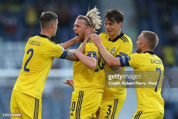 Emil Forsberg of Sweden celebrates with Mikael Lustig, Victor Lindeloef and Sebastian Larsson after scoring their side's first goal during the UEFA...