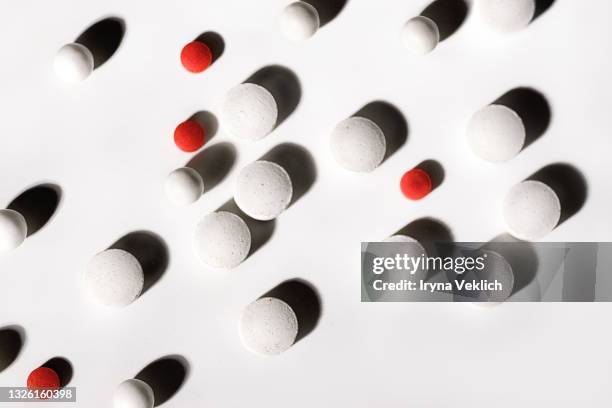 Pills Background White And Red Tablets On A White Background High-Res Stock Photo