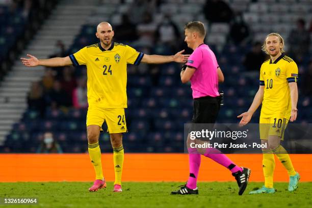 Marcus Danielson of Sweden reacts after being shown a red card by Match Referee, Daniele Orsato after a VAR review during the UEFA Euro 2020...