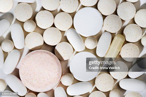pills background, tablets on a white background. - exercise pill stock-fotos und bilder