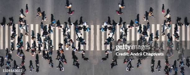 Crowd of people at pedestrian crossing in the city - overhead panorama shot of people pedestrians