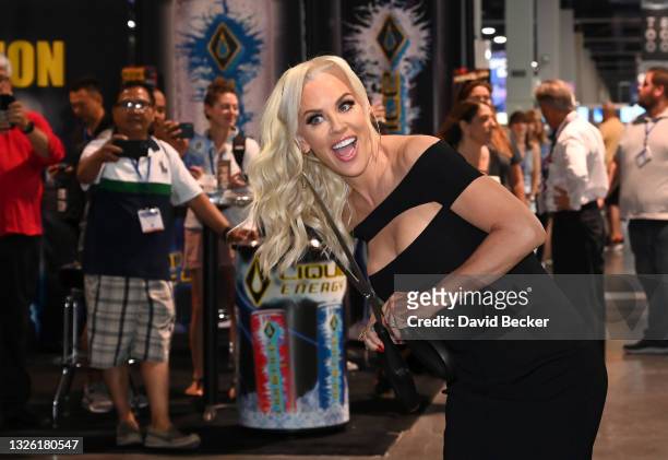 Jenny McCarthy cuts the ribbon during Day 2 of the 35th Annual Nightclub & Bar Show and World Tea Expo at the Las Vegas Convention Center on June 29,...