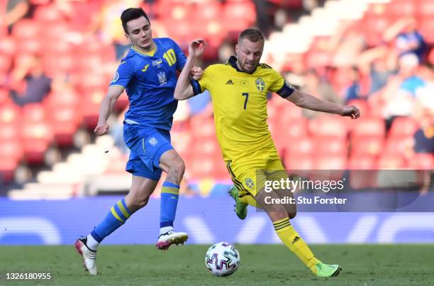 Sweden player Sebastian Larsson is challenged by Mykola Shaparenko of Ukraine during the UEFA Euro 2020 Championship Round of 16 match between Sweden...