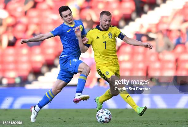 Sweden player Sebastian Larsson is challenged by Mykola Shaparenko of Ukraine during the UEFA Euro 2020 Championship Round of 16 match between Sweden...