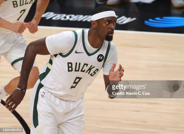 Bobby Portis of the Milwaukee Bucks runs up court after a three point basket against the Atlanta Hawks during the first half in Game Four of the...