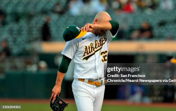 June 29: James Kaprielian wipes his brow after finishing the fifth inning and giving up the lead earlier on a Joey Gallo solo homerun as the Oakland...