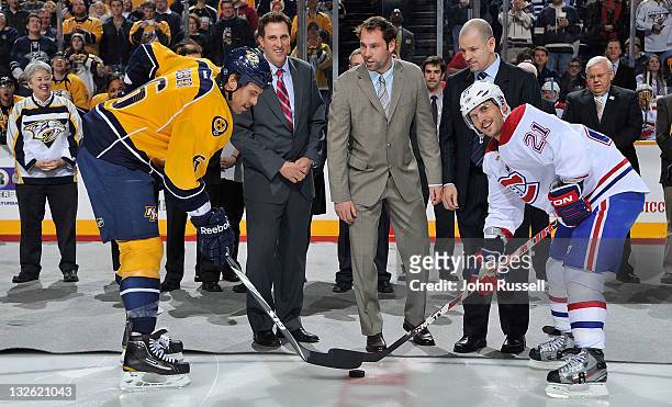 Nashville Predators Shea Weber and Brian Gionta of the Montreal Canadiens with the ceremonial faceoff with Predators alumni Tom Fitzgerald and Mike...