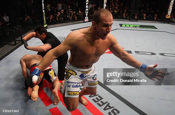 Junior dos Santos celebrates after punching to defeat Cain Velasquez by TKO in the first round of their Heavyweight Championship Title bout during...
