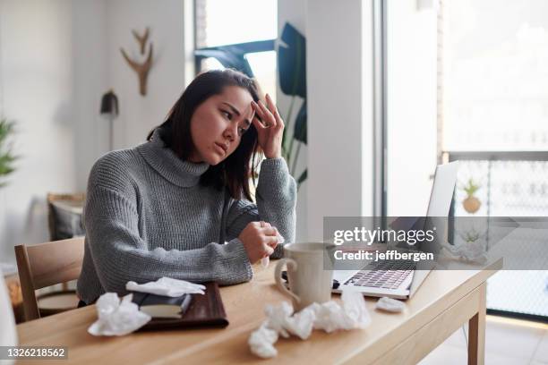 shot of a woman feeling unwell while working from home - sinus stock pictures, royalty-free photos & images