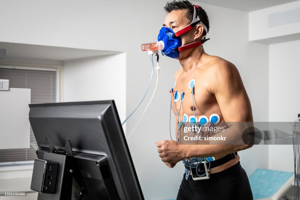 Man running on the treadmill ergometer during a cardiopulmonary stress test
