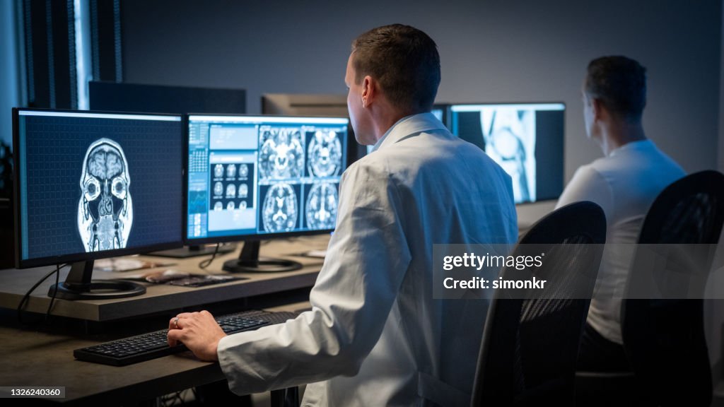 Meei Radiologist Male Radiologist Analysing The Mri Image Of The Head High-Res Stock ...