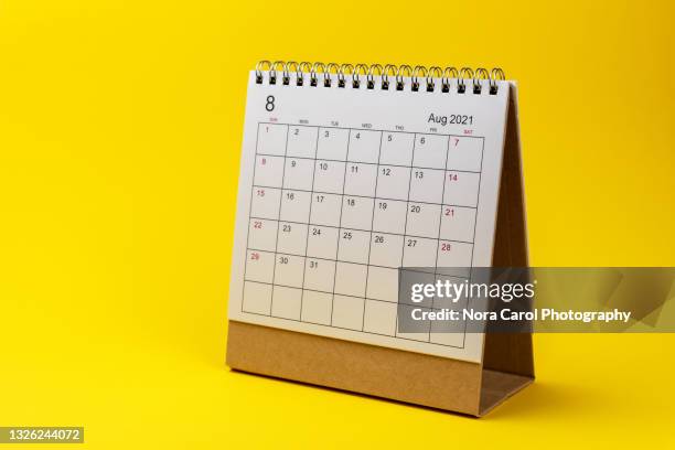 august 2021 calendar on yellow background - calendar isolated stock pictures, royalty-free photos & images