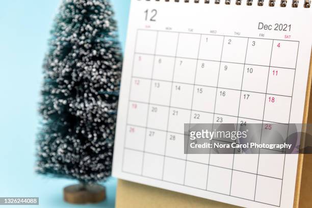 close up december 2021 calendar on blue background - 2021 calendar stock pictures, royalty-free photos & images
