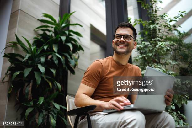 portrait of a successful young man - laptop person imagens e fotografias de stock