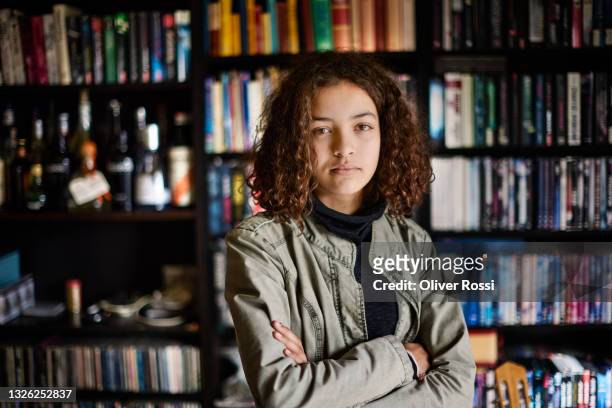 portrait of a serious teenage girl at home - confident girl imagens e fotografias de stock