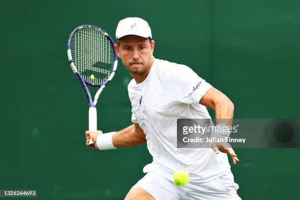 James Duckworth of Australia plays a forehand in his Men's Singles First Round match against Radu Albot of Moldova during Day Three of The...