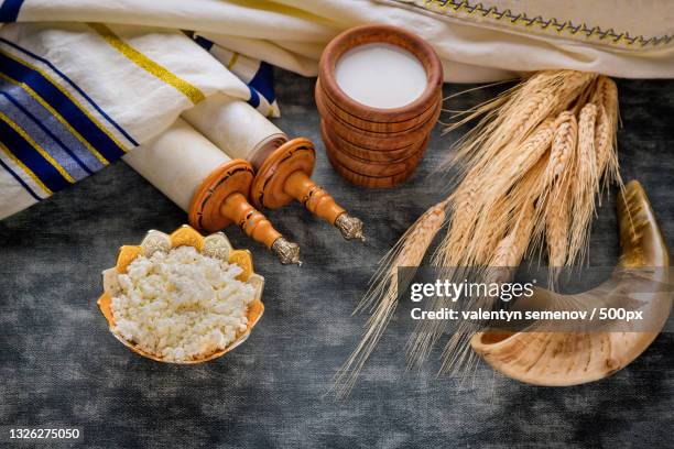 traditional jewish holiday items on textured background - shavuot stock pictures, royalty-free photos & images